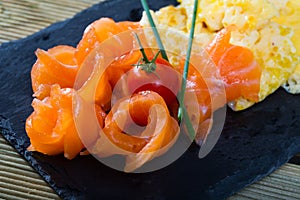 Dish of Norwegian cuisine of cooked omlette fried and served with salmon