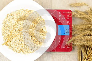 Dish of oatmeal on electronic kitchen scales