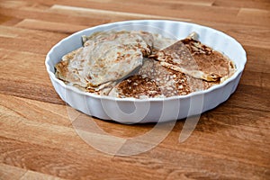 Dish with pancakes on a taule