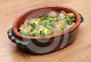 Dish with potatos and meat