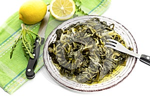A dish of rare boiled grass `stamnagathi`Cichorium spinosum