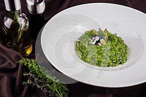 Dish of risotto with asparagus closeup
