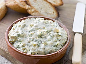 Dish of Sauce Gribiche with Toasted Baguette