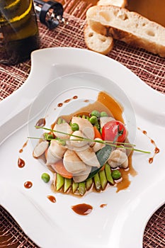 Dish with seafoods and vegetables photo