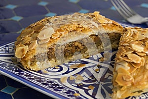 Dish with sliced traditional Moroccan small bastella