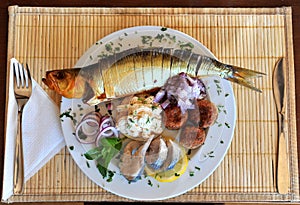 Dish with smoked herring and fish meat