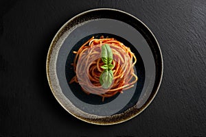 Dish with spaghetti tomato and basil