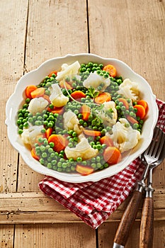 Dish of tender young steamed frozen vegetables