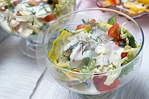 Dish of tomatoes, lettuce, dill, red pepper with mayonnaise