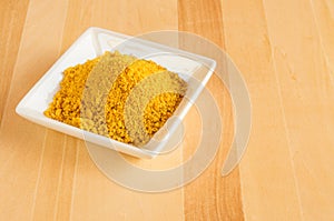 Dish of tumeric spice for use in cooking