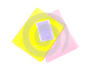 Dish washing sponge. Yellow and pink rags. Close up. Isolated on