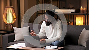 Disheartened Businessman Having Video Call in the Evening at Home