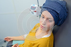 Disheartened woman during chemotherapy