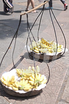 Dishes with bananas of the street vendors