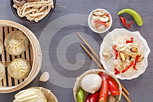 Dishes of Chinese cuisine in assortment. Steam dumplings, noodles, salads, vegetables, mushrooms, seafood.