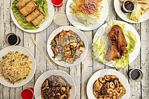 Dishes of popular Chinese gastronomy from European restaurants. Roast duck, chicken with almonds, beef with mushrooms, prawns with