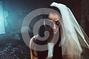 Disheveled bride with tear stained face