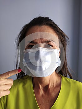 Disheveled Doctor woman wearing a mask