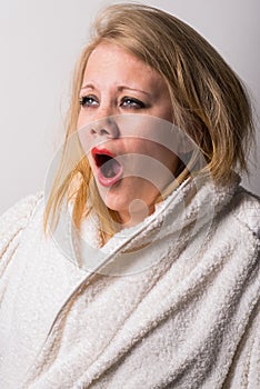 Disheveled morning tired young woman yawning