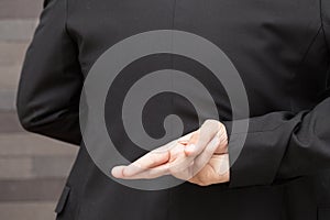 Dishonesty, Business fraud concept, Businessman showing fingers