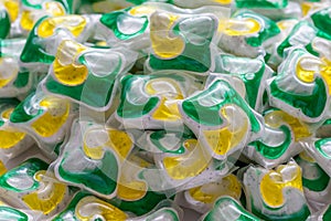 Dishwasher detergent capsules and or laundry soap close-up background.