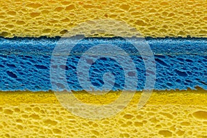 Dishwashing concept, Background of yellow sponge and light blue sponge for dish cleaning in kitchen