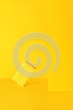 Dishwashing sponge on yellow, minimalism, monochrome