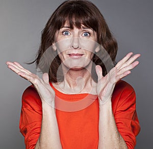 Disillusioned 50s woman expressing despair and frustration photo