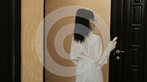 Disinfect the door handle with antibacterial solution in hospital quarantine