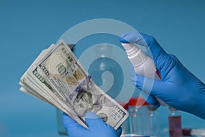 Disinfecting banknotes to stop spread of coronavirus. sterilize dollar banknotes photo