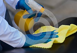 Disinfecting a surface to prevent spread of infections