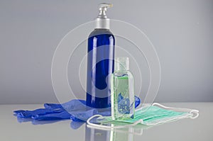 Disinfection liquids, face mask and disposable glove - pandemics precaution photo
