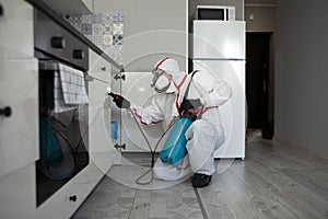 Disinfection of premises against insects and rodents by chemical means, a sanitary worker with a spray on the background of the