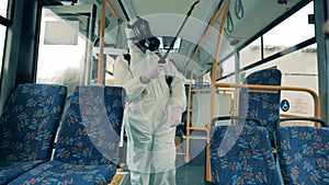 Disinfectors are entering the bus and starting sanitation