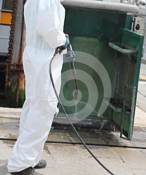 disinfestation with a pressure washer of street furniture during