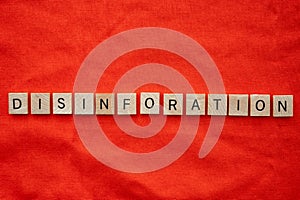 Disinformation concept with tile lettering