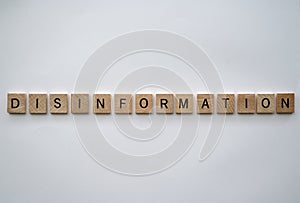 Disinformation concept with tile lettering
