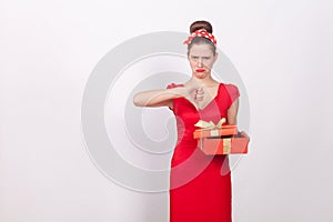 Dislike. Woman holding red box and demonstrate thumb down