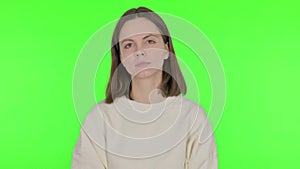 Disliking Young Woman in Denial on Green Background