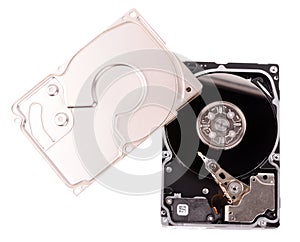 Dismanteled hard disk and screwdriver on white background