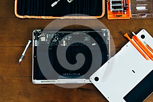 Dismantle laptop with tools and battery, display, hard disk and other components