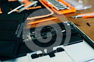 Dismantle laptop with tools and battery, display, hard disk and other components