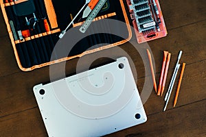 Dismantle laptop with tools and battery, display, hard disk and other components