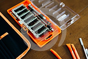 Dismantle laptop with tools and battery, display, hard disk and other components