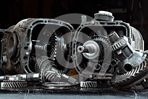 Dismantled car gearbox with gears, close-up. Repair box predach, repair of used cars. Metal background