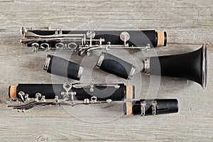 Dismantled Clarinet on a Weathered Wood Table