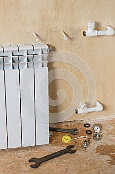 Dismantled failed radiator in a private home. Accident of the heating system of a private house