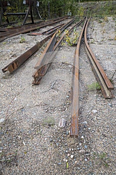Dismantled railroad rails on ground outdoors
