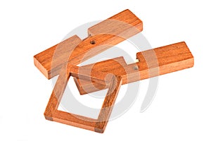Dismantled wooden cross puzzle isolated on a white background