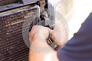 Dismantling broken car radiator